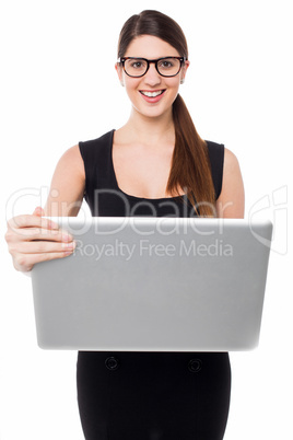 Smart business lady holding a laptop