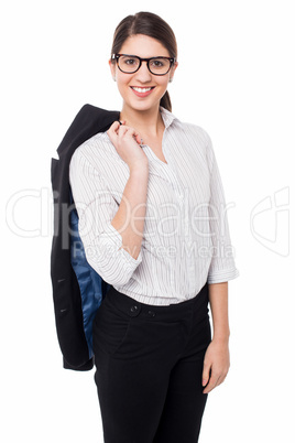 Corporate lady with blazer slung over her shoulder