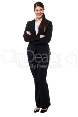 Smiling business executive with arms crossed