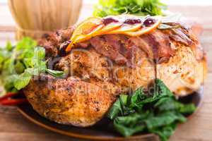 baked turkey with chestnut filling and orange - selective focus