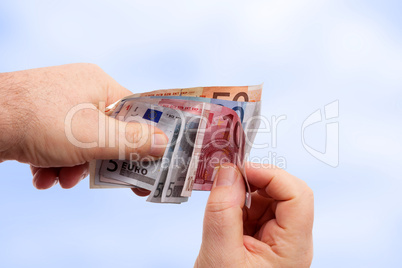 Hands holding banknotes