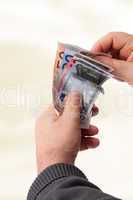 Hands counting banknotes