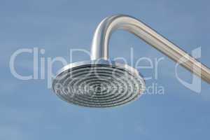 close up on head shower in a blue sky