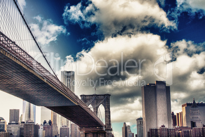 Amazing sunset colors over New York Cityscape and Brooklyn Bridg