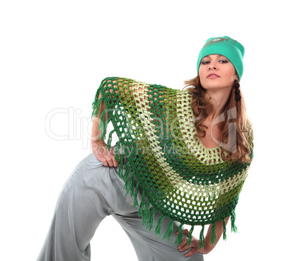 Girl in a green knit poncho on tne white background