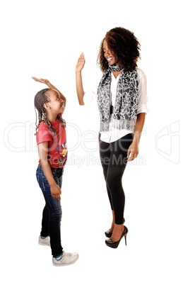 Black sisters playing.