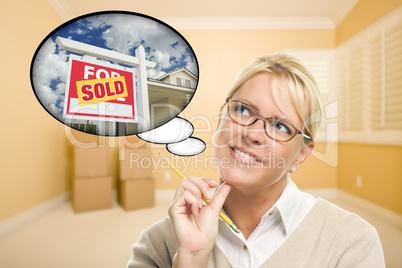 Woman in Empty Room with Thought Bubble of Sold Real Estate Sign