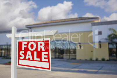 Vacant Retail Building with For Sale Real Estate Sign
