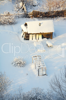 small house under snow