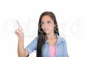 Portrait of young business woman pointing at white background