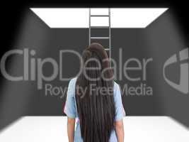 woman standing in a pit looking up to the ladder that leads out