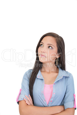 Thoughtful and worried woman looking up, isolated over a white b