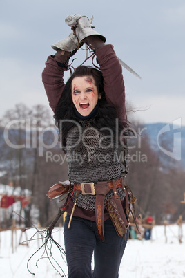 Woman in the medieval costume with a sword