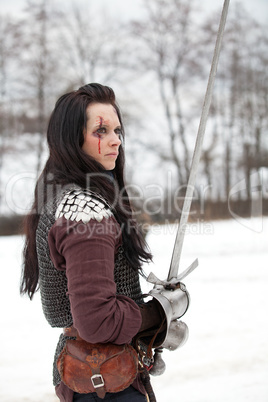 Beautiful young woman in medieval clothes