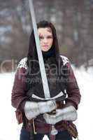 Beautiful young woman in medieval clothes