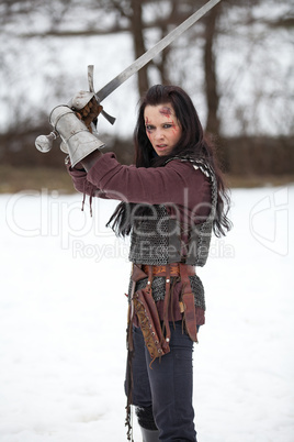 Beautiful young woman in medieval clothes