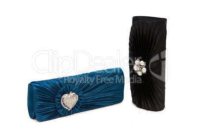 Luxurious clutch bags isolated on white