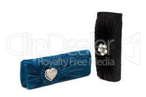 Luxurious clutch bags isolated on white