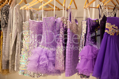 Glitter dresses in a closet/store
