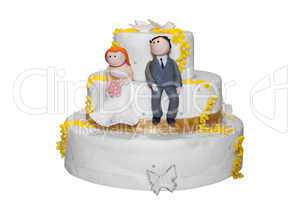 Bride and groom figurines on top of a wedding cake