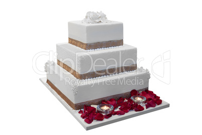 elegant wedding cake decorated with rose petals and candles, iso