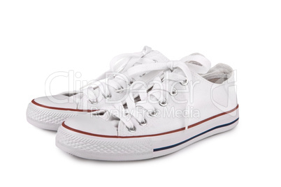 Pair of new white sneakers on white background