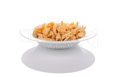 Potato chips on a plate, isolated on white