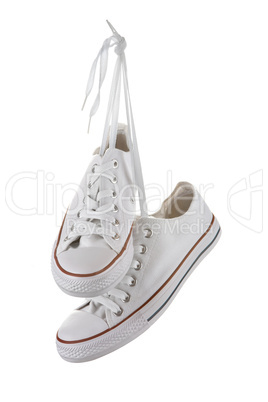 Pair of new white sneakers isolated on white