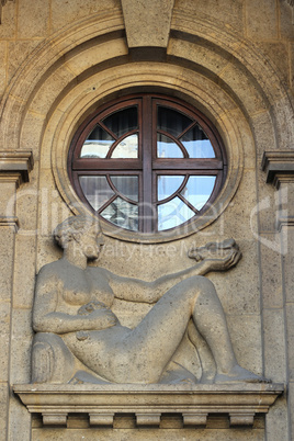 Building facade with relief of a woman in Zagreb, Croatia