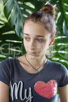 Teenage girl with pink heart on her T-shirt
