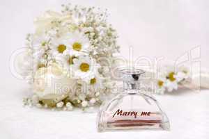 Wedding bouquet and perfume bottle