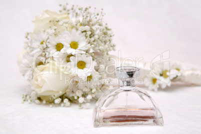 Wedding bouquet and perfume bottle