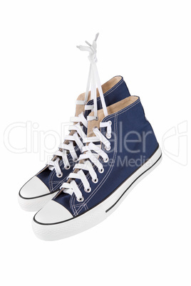 Pair of new blue sneakers isolated on white