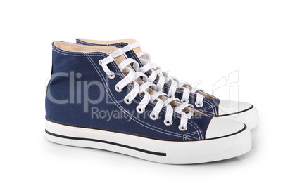 Pair of new blue sneakers on white background