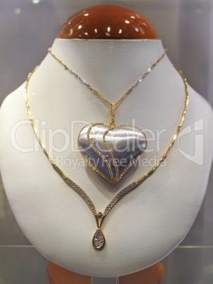 golden necklace with a heart pendant