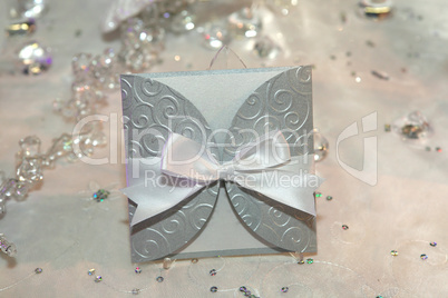 Elegant wedding invitation with a bow
