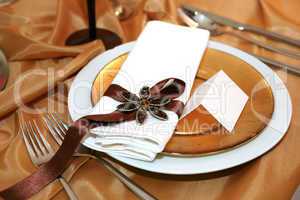 elegant dinner in orange with blank tag on a plate