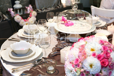 Table setting in beige and brown for elegant dinner