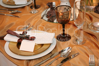 elegant dinner in orange with blank tag on a plate