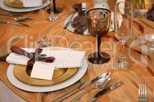 elegant dinner in orange with blank tag on a plate