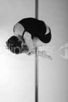 Art photo of a woman on the pole, black and white