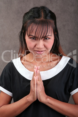 Thai woman in traditional greeting gesture
