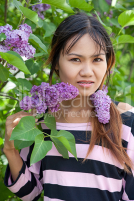 Beautiful Thai woman with braces in the park