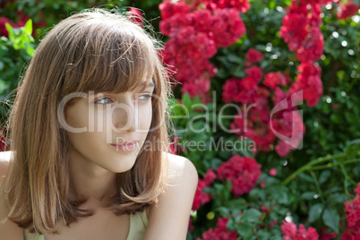 Portrait of a teenage girl in the rose garden
