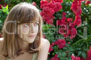 Portrait of a teenage girl in the rose garden