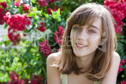 Portrait of a teenage girl in the flower garden