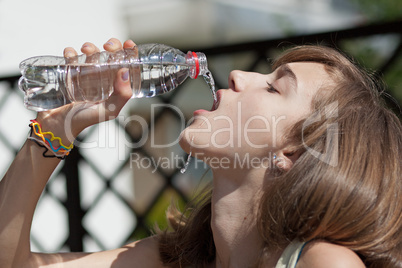 Teenage girl drinking water