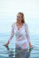 Beautiful blond woman in wet shirt