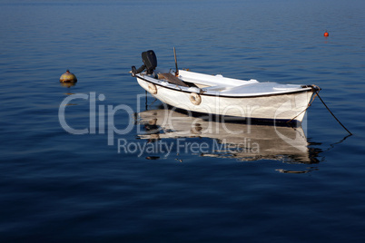 Elegant white boat on blue water