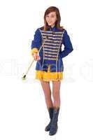 Teenage majorette in her uniform twirling a baton